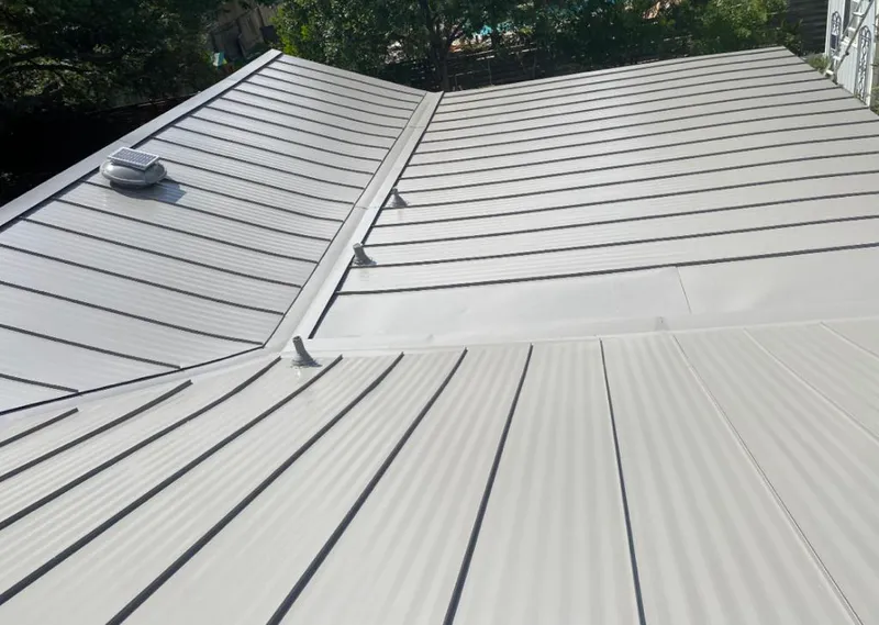 Solar attic fan installed on a metal roof for Roof Ventilation in Irmo